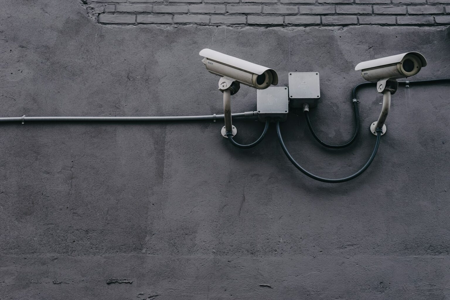 Security Camera Systems & Professional Installation in Los Angeles Two bullet security cameras mounted on a building wall
