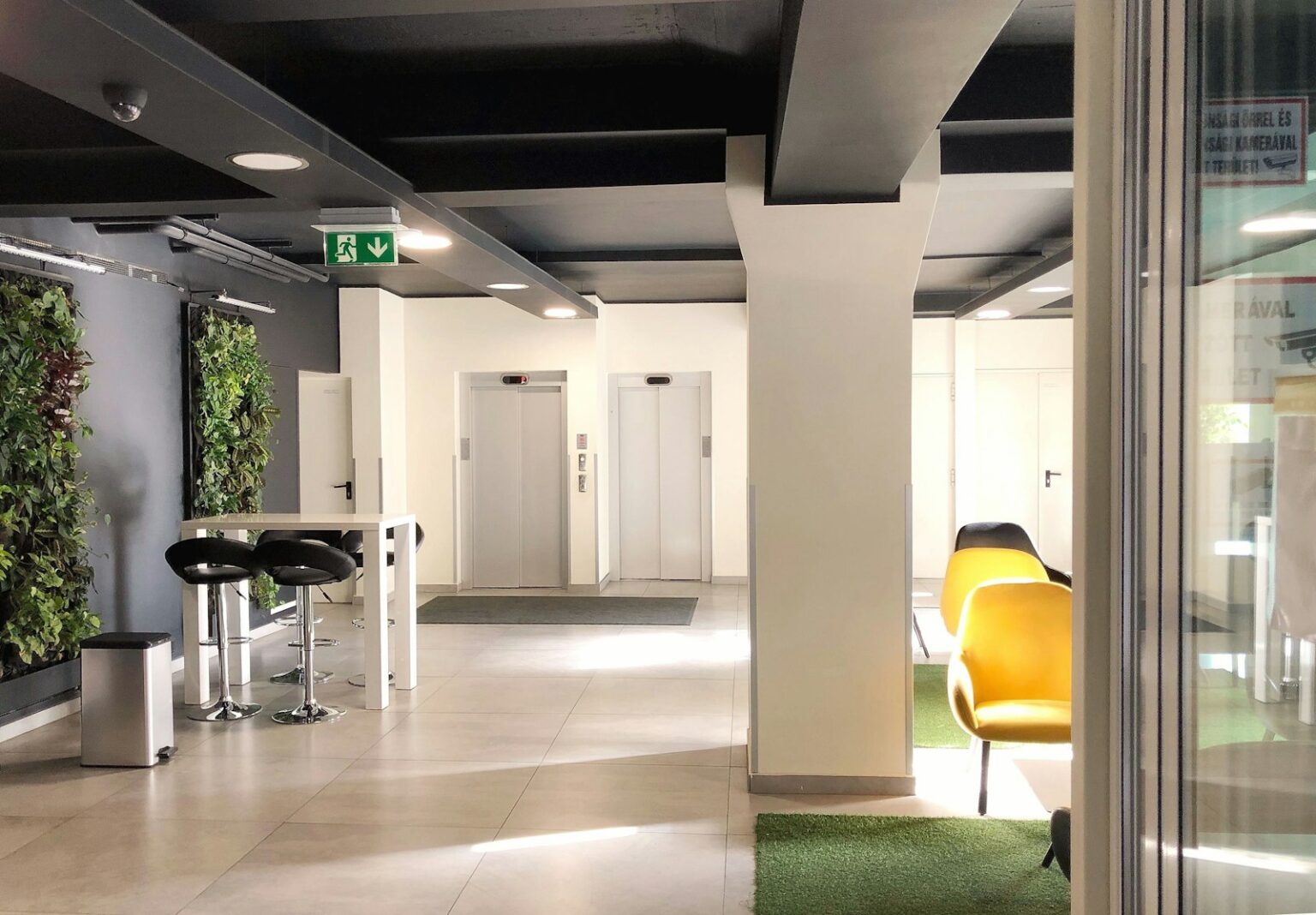 Access Control and Security Intercom Systems for Los Angeles Modern office lobby with elevators
