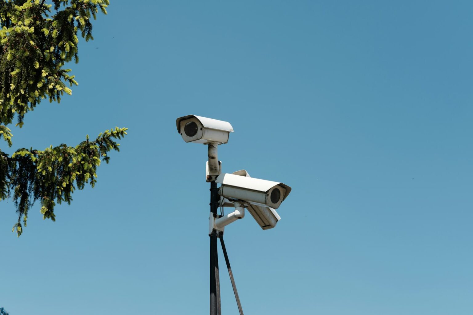 Access Control and Security Intercom Systems for Los Angeles Outdoor security cameras mounted on a pole