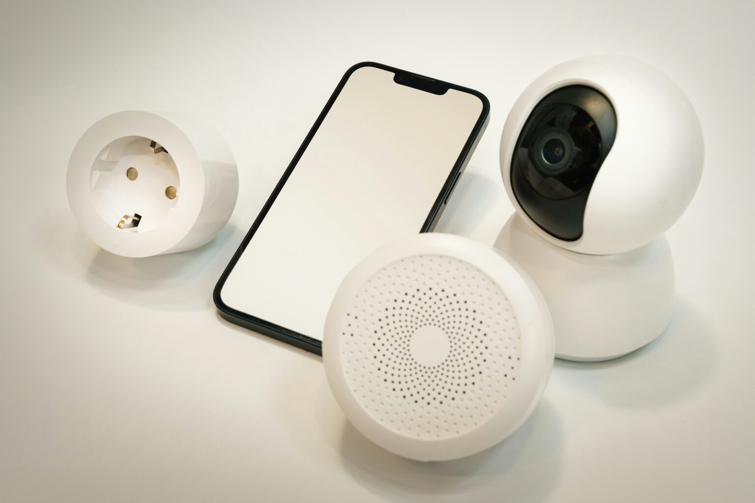 Ajax Security System: 7 Reasons to Upgrade in 2026 Smart home security devices next to a smartphone